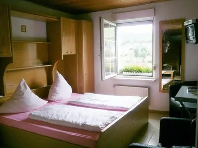 Ein Bett oder Betten in einem Zimmer der Unterkunft Mosel Panorama