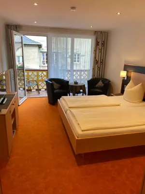 Ein Bett oder Betten in einem Zimmer der Unterkunft Hotel Moselterrasse
