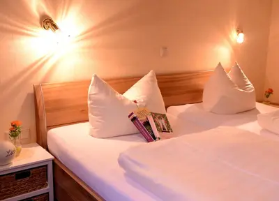 Ein Bett oder Betten in einem Zimmer der Unterkunft Hotel Moselterrasse
