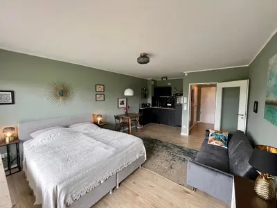Ein Bett oder Betten in einem Zimmer der Unterkunft #2 Studioapartment mit Loreleyblick direkt an der schönsten Etappe des Rheinsteigs