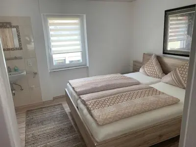 Ein Bett oder Betten in einem Zimmer der Unterkunft Wein- und Sektgut Markus Hensler