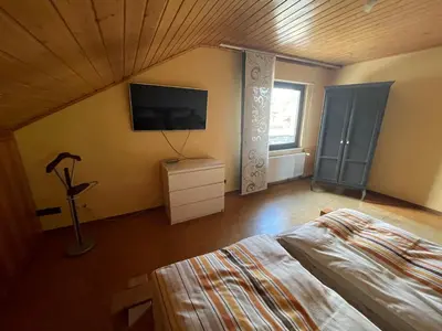 Ein Bett oder Betten in einem Zimmer der Unterkunft Ferienwohnung zum Nürburgring