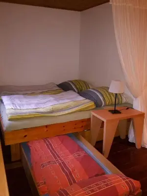 Ein Bett oder Betten in einem Zimmer der Unterkunft Ferienhaus Neumühle