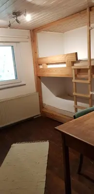 Ein Bett oder Betten in einem Zimmer der Unterkunft Ferienhaus Neumühle