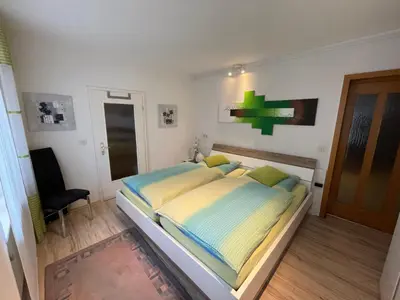 Ein Bett oder Betten in einem Zimmer der Unterkunft Ferienwohnung Hilger