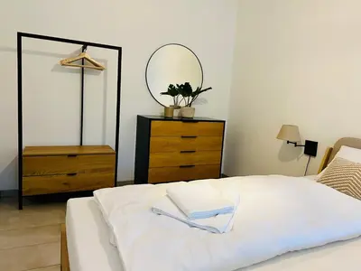 Ein Bett oder Betten in einem Zimmer der Unterkunft Moselblick II ad Reichsburg Parkplatz 100m Marktplatz