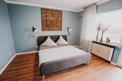 Ein Bett oder Betten in einem Zimmer der Unterkunft SOONWALD Apartment mit Garten & Hot Tube