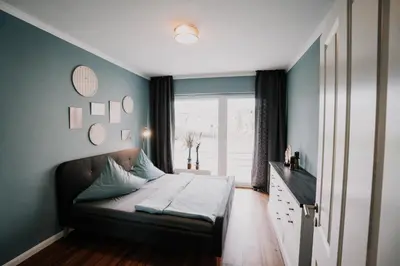 Ein Bett oder Betten in einem Zimmer der Unterkunft SOONWALD Apartment mit Garten & Hot Tube