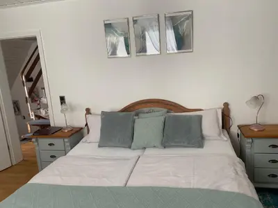 Ein Bett oder Betten in einem Zimmer der Unterkunft Alte Schmiede in der Altstadt von Sankt Goarshausen - Loreley