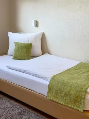Ein Bett oder Betten in einem Zimmer der Unterkunft Gasthaus Wollscheid