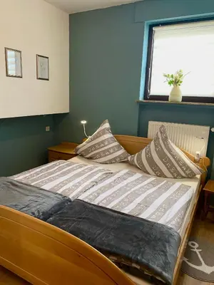 Ein Bett oder Betten in einem Zimmer der Unterkunft Ferienwohnung Laura