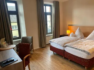 Ein Bett oder Betten in einem Zimmer der Unterkunft Hotel Bären