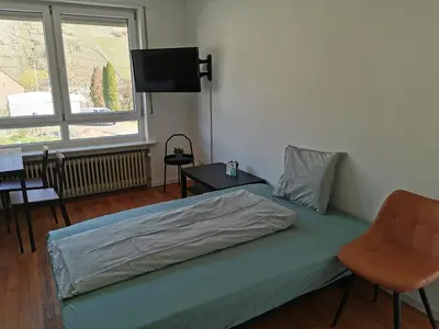 Ein Bett oder Betten in einem Zimmer der Unterkunft Ferienwohnung Zum Moselfischer