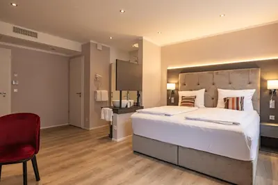 Ein Bett oder Betten in einem Zimmer der Unterkunft MEA HOTEL TRIER