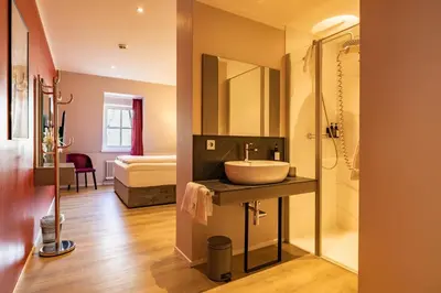 Ein Bett oder Betten in einem Zimmer der Unterkunft MEA HOTEL TRIER