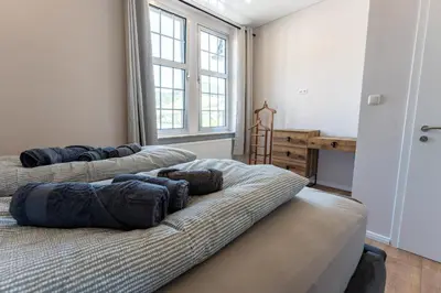 Ein Bett oder Betten in einem Zimmer der Unterkunft Moselresidenz Bellevue Alf