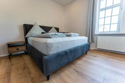 Ein Bett oder Betten in einem Zimmer der Unterkunft Moselresidenz Bellevue Alf