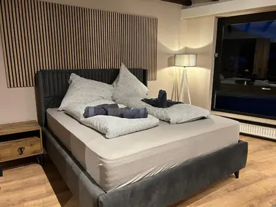 Ein Bett oder Betten in einem Zimmer der Unterkunft Moselresidenz Bellevue Alf