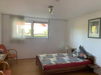 Ein Bett oder Betten in einem Zimmer der Unterkunft Haus Idylle Weindorf Duchroth - Helle Souterrain Ferienwohnung