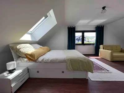 Ein Bett oder Betten in einem Zimmer der Unterkunft Gasthaus Maarfeld Gerolstein