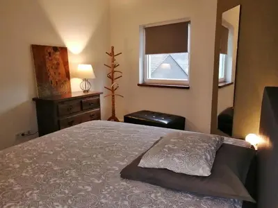 Ein Bett oder Betten in einem Zimmer der Unterkunft KyllHof Angelsen