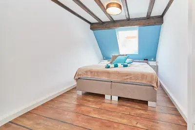 Ein Bett oder Betten in einem Zimmer der Unterkunft Fachwerkperle am historischen Marktplatz