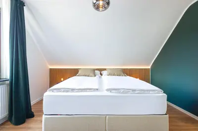 Ein Bett oder Betten in einem Zimmer der Unterkunft Hotel Zweite Heimat Nürburg
