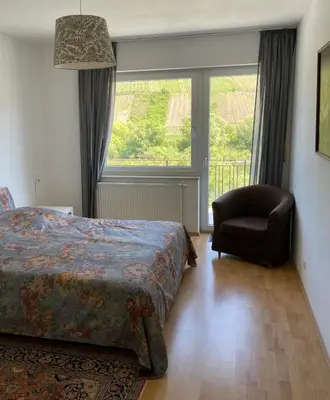 Ein Bett oder Betten in einem Zimmer der Unterkunft Ferienwohnung FM Moselle