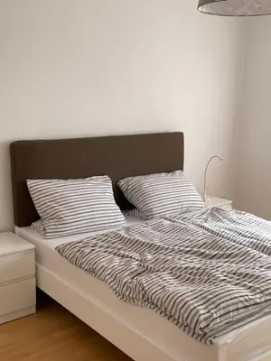 Ein Bett oder Betten in einem Zimmer der Unterkunft Ferienwohnung FM Moselle