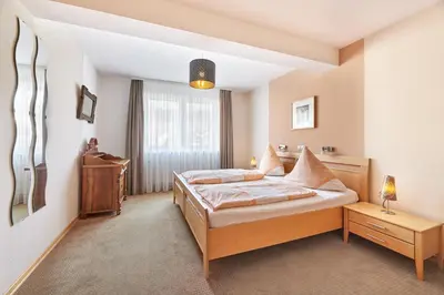 Ein Bett oder Betten in einem Zimmer der Unterkunft Ferienweingut Andrae-Goebel
