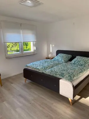 Ein Bett oder Betten in einem Zimmer der Unterkunft Ferienhaus MaLu