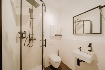 Ein Badezimmer in der Unterkunft LLR Design Apartment - Sienna Beige im Zentrum von Koblenz