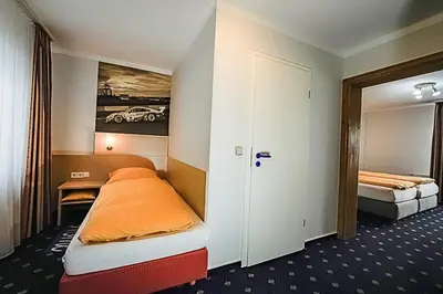 Ein Bett oder Betten in einem Zimmer der Unterkunft Gästehaus Fuchshof