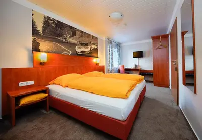 Ein Bett oder Betten in einem Zimmer der Unterkunft Gästehaus Fuchshof