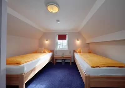 Ein Bett oder Betten in einem Zimmer der Unterkunft Gästehaus Fuchshof