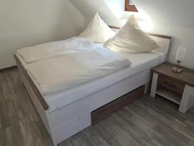 Ein Bett oder Betten in einem Zimmer der Unterkunft Ferienhaus Mühlental 52