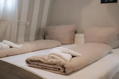 Ein Bett oder Betten in einem Zimmer der Unterkunft Villa Moselstrand