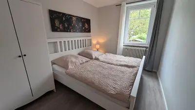 Ein Bett oder Betten in einem Zimmer der Unterkunft Villa Moselstrand