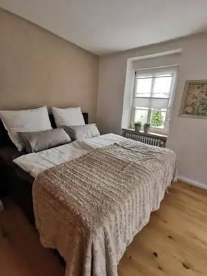 Ein Bett oder Betten in einem Zimmer der Unterkunft Das Kirch24 - DAS Ferienhaus in Heidenburg