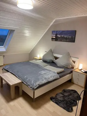 Ein Bett oder Betten in einem Zimmer der Unterkunft Ferienwohnung Moselherz