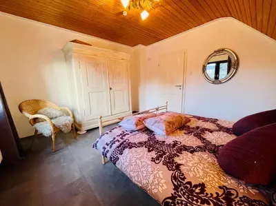 Ein Bett oder Betten in einem Zimmer der Unterkunft Ferienhaus Greta