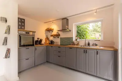 Küche/Küchenzeile in der Unterkunft Adenauer Zwölf - Das 5 Sterne Ferienhaus mit Sauna und Garten am Eifelsteig