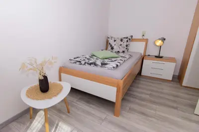 Ein Bett oder Betten in einem Zimmer der Unterkunft Ferienweingut Jürgen Beth