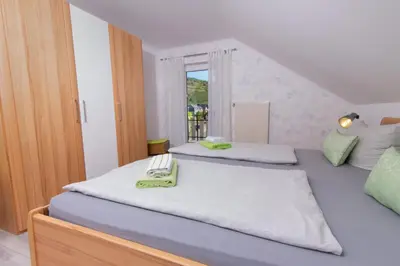 Ein Bett oder Betten in einem Zimmer der Unterkunft Ferienweingut Jürgen Beth