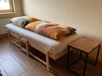 Ein Bett oder Betten in einem Zimmer der Unterkunft Feriendomizil Marika