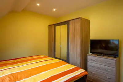 Ein Bett oder Betten in einem Zimmer der Unterkunft Ferienwohnung Alexander