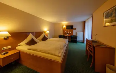 Ein Bett oder Betten in einem Zimmer der Unterkunft Hotel Burgfrieden