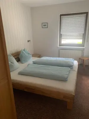 Ein Bett oder Betten in einem Zimmer der Unterkunft Ferienhaus Lönartz-Thielmann