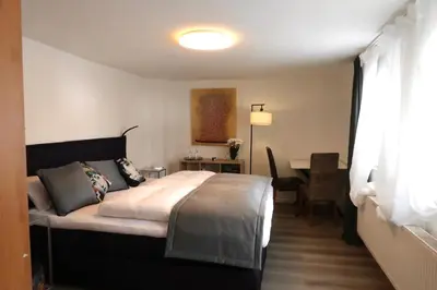 Ein Bett oder Betten in einem Zimmer der Unterkunft Julia's Mosel Villa Appartement NICOLAS