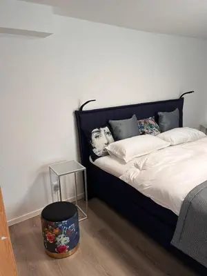 Ein Bett oder Betten in einem Zimmer der Unterkunft Julia's Mosel Villa Appartement NICOLAS